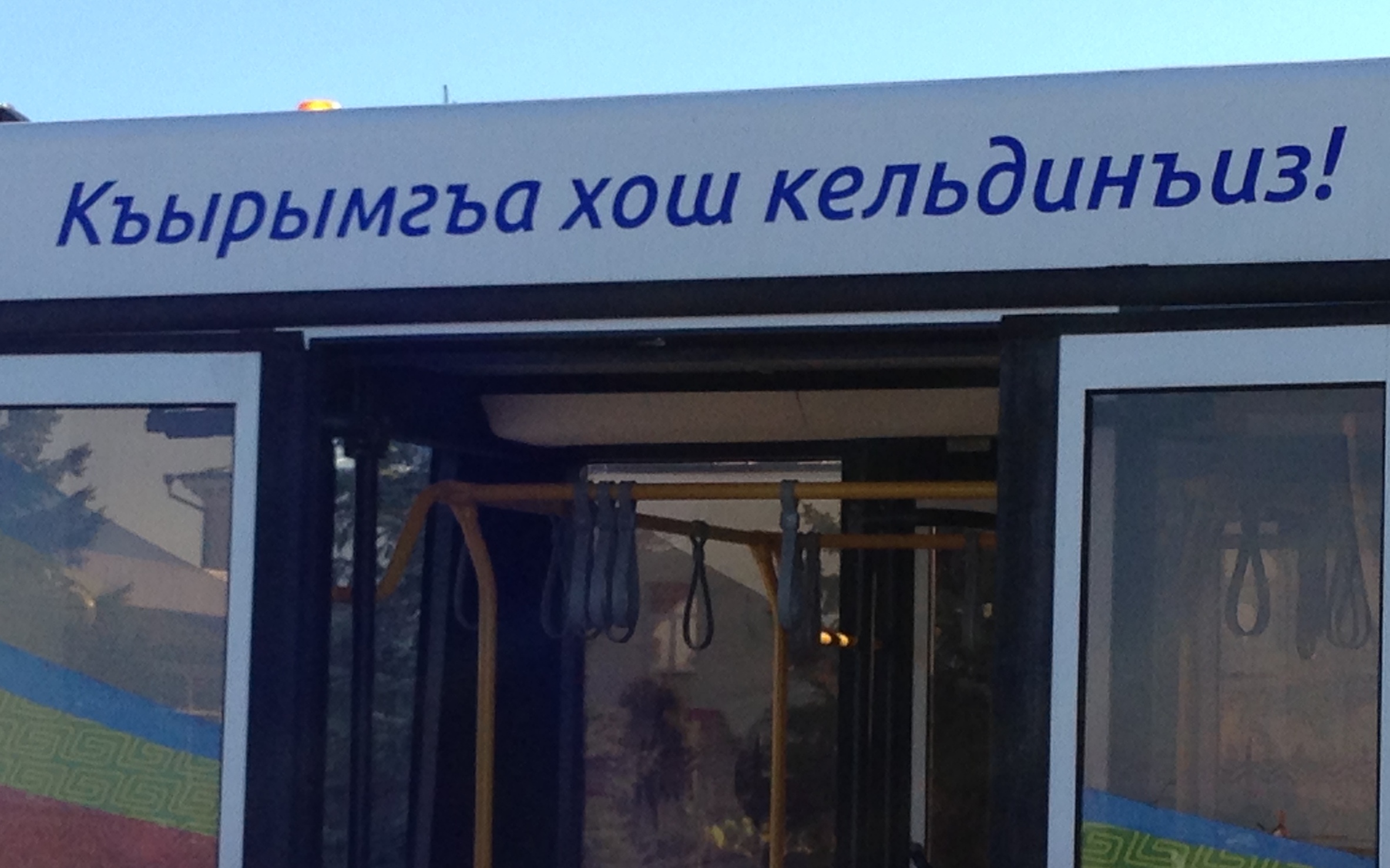 Crimean_Tatar_language_on_airport_bus_Simferopol