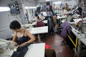 Seamstresses at work inside Vladimir Foton's workshop. Bishkek. David Trilling